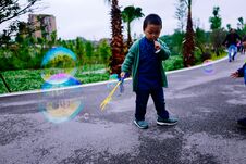 Little Boy Making Soap Bubbles Royalty Free Stock Photography