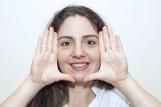 Young Woman Framing Her Face With Hands Royalty Free Stock Photo