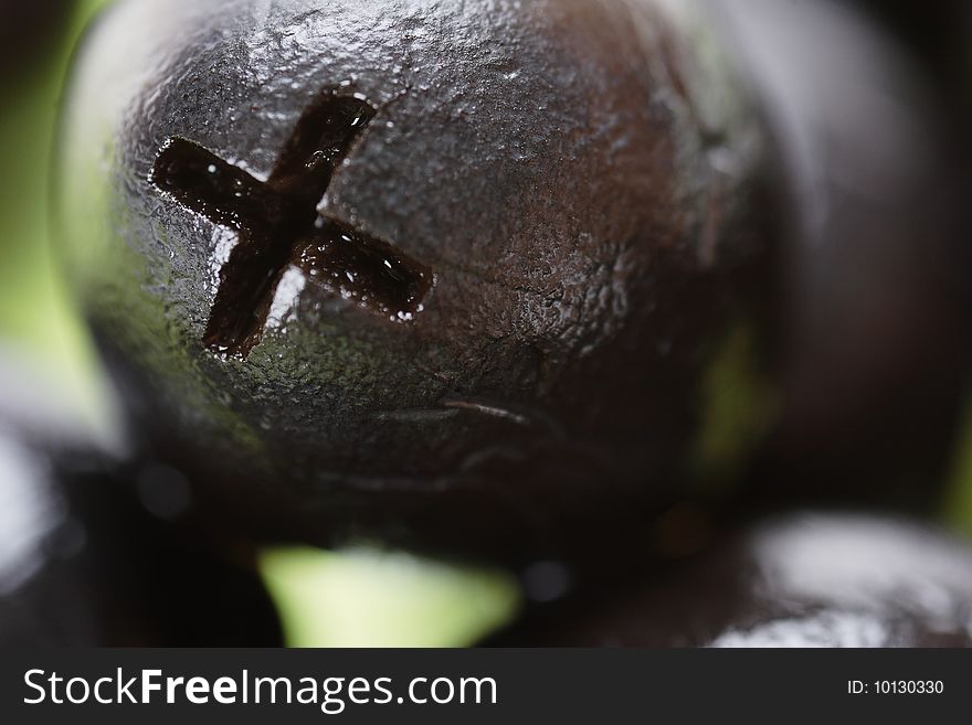 Black olives on the plate. Narrow depth of field. Macro. Black olives on the plate. Narrow depth of field. Macro.