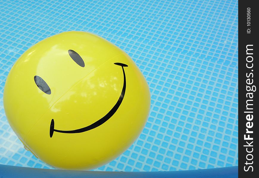 Pool inflatibles in the summer of smiley yellow ball. Pool inflatibles in the summer of smiley yellow ball
