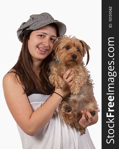 Cute teenage hispanic girl holding a pet yorkshire terrier dog. Cute teenage hispanic girl holding a pet yorkshire terrier dog