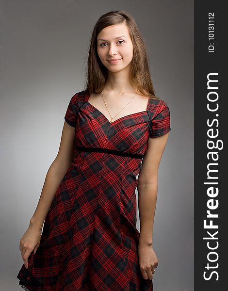 Young beautiful woman in dress posing