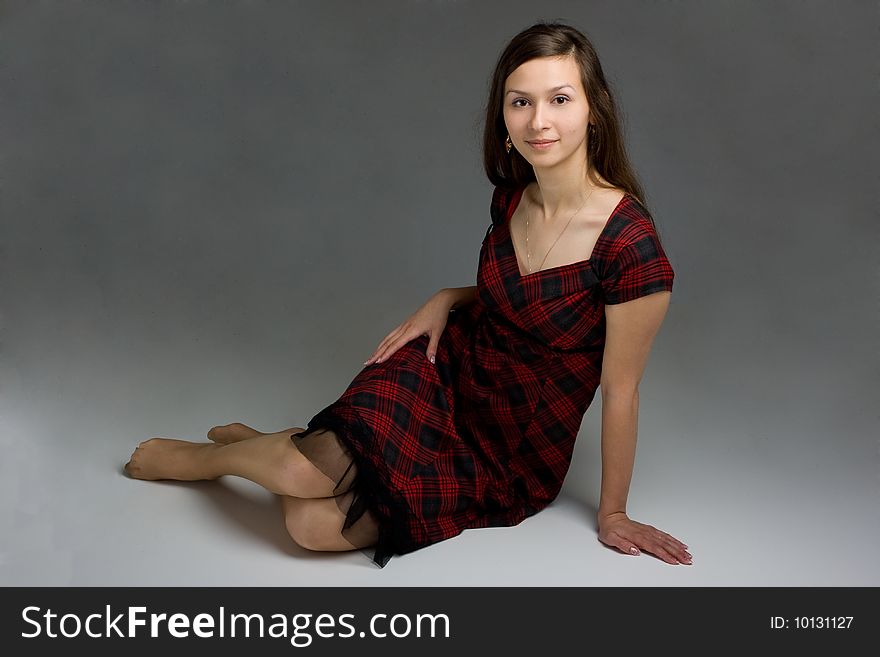 Young beautiful woman in dress posing