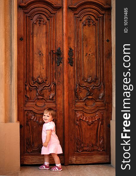 Little girl knocking at the door