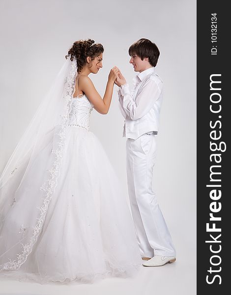 Young woman and man in a wedding clothing. Young woman and man in a wedding clothing