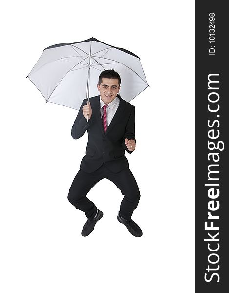 Young man in suit flying with umbrella