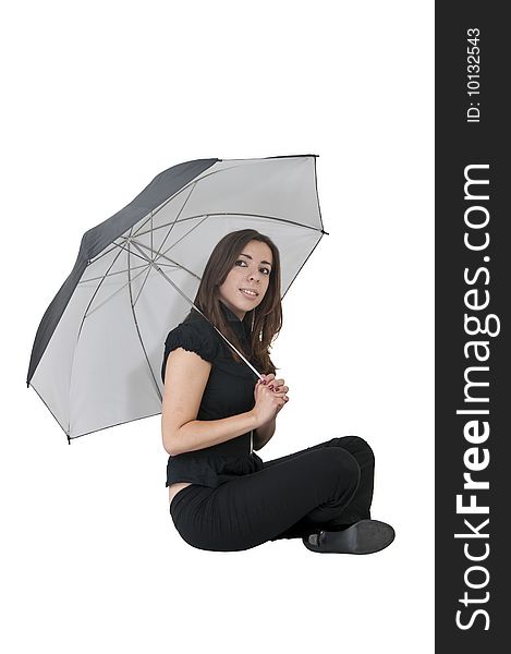 Young woman sitting with umbrella