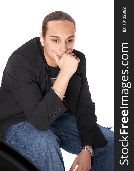 Young man with long hair is thinking hard. Isolated over white.