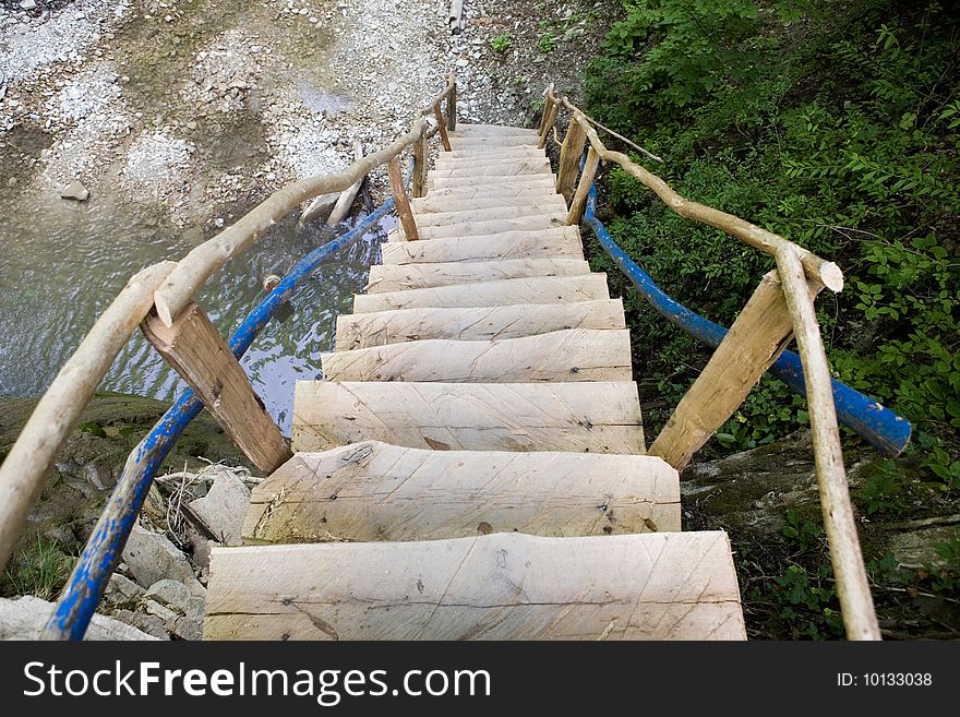 Wooden stairway near the waterfall