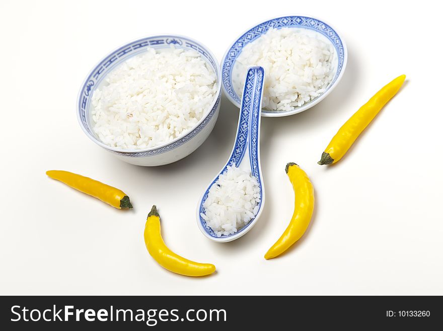 A bowl of perfectly cooked, plain Basmati rice, in an Asian style bowl, with a garnish of Thai Basil. A bowl of perfectly cooked, plain Basmati rice, in an Asian style bowl, with a garnish of Thai Basil