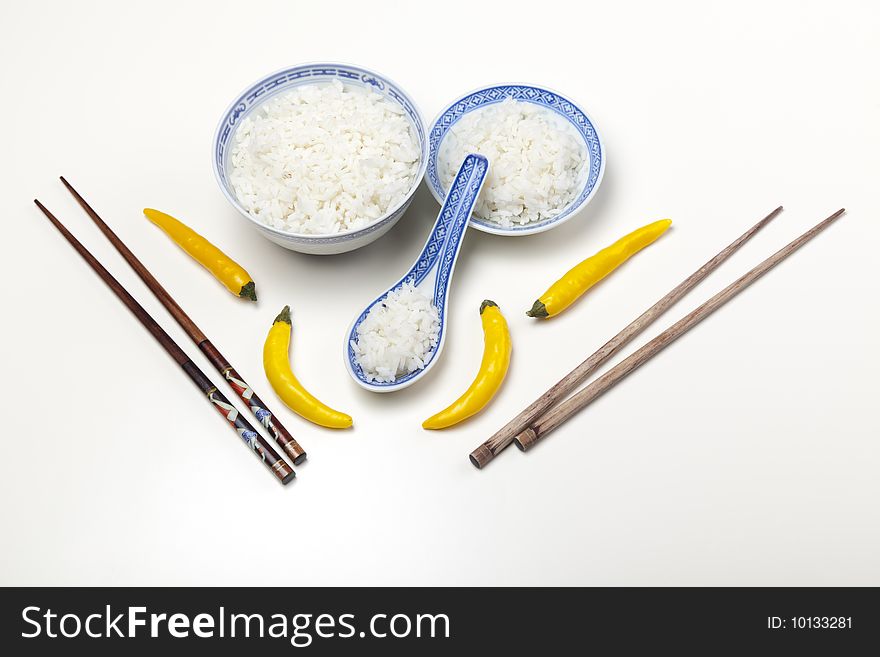 A bowl of perfectly cooked, plain Basmati rice, in an Asian style bowl, with a garnish of Thai Basil. A bowl of perfectly cooked, plain Basmati rice, in an Asian style bowl, with a garnish of Thai Basil