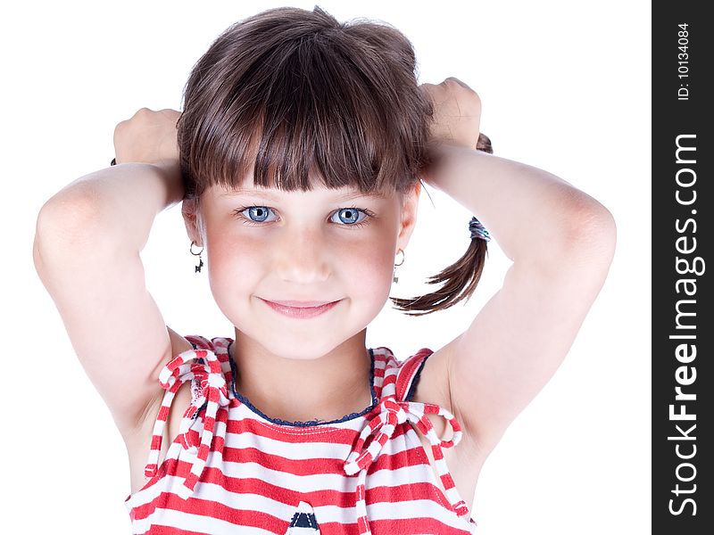 Little cute girl hold her pig tails, studio shot