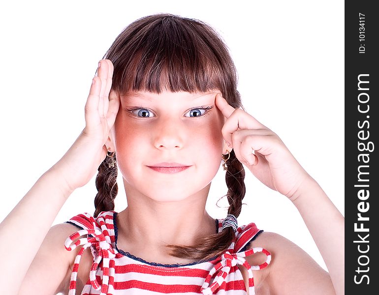 Cute little blue eyed girl making grimace, studio shot