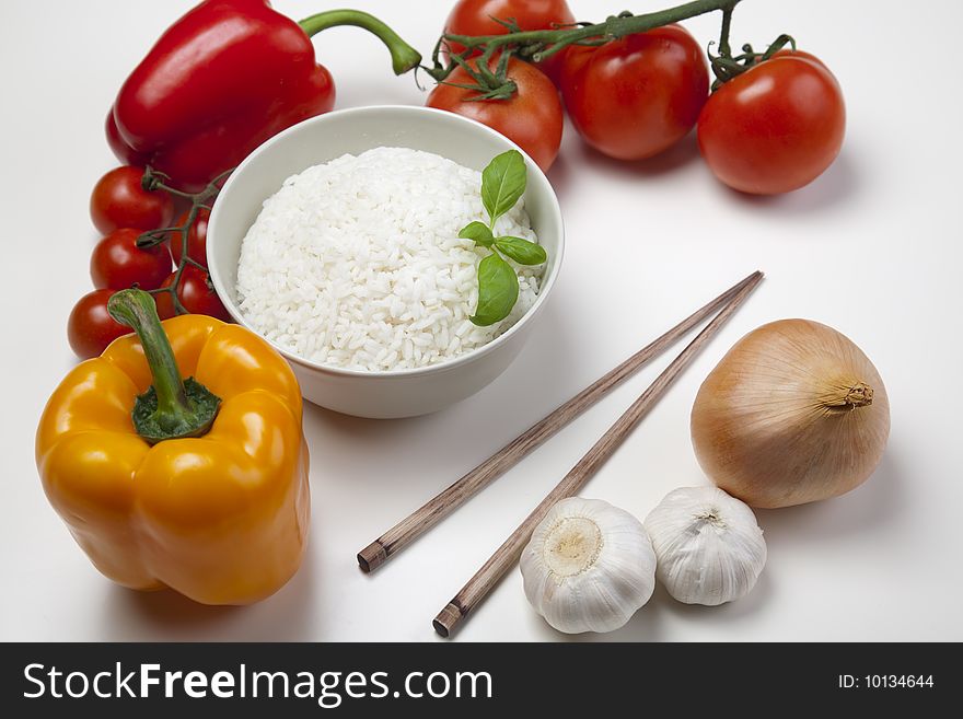 A bowl of perfectly cooked, plain Basmati rice, in an Asian style bowl, with a garnish of Thai Basil. A bowl of perfectly cooked, plain Basmati rice, in an Asian style bowl, with a garnish of Thai Basil