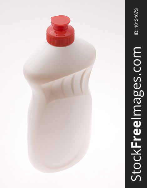 White plastic bottle with red cap. White plastic bottle with red cap