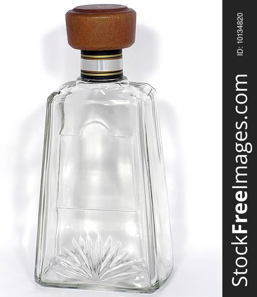 Empty transparent glass bottle with a cork