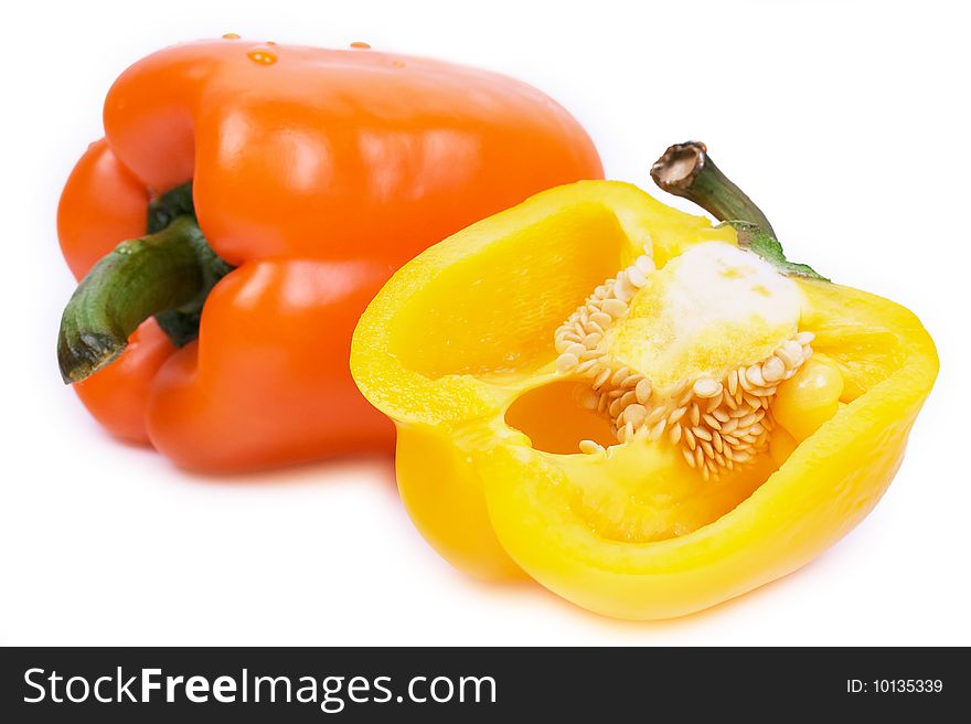 Closed-up yellow pepper and cut pepper isolated on white background. Closed-up yellow pepper and cut pepper isolated on white background