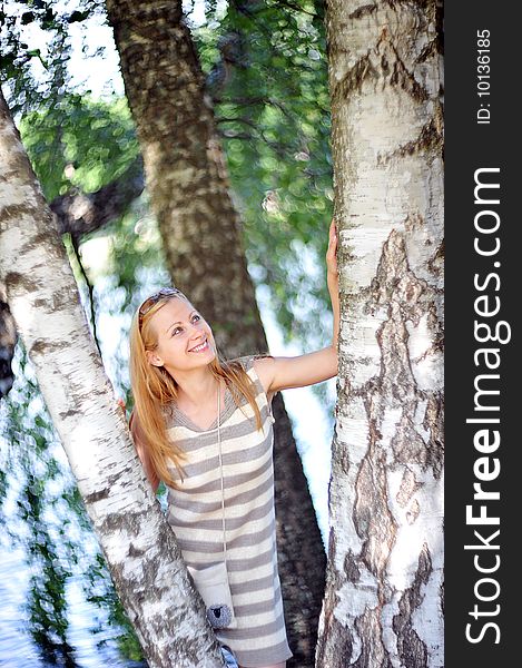 Beautiful young woman in park portrait