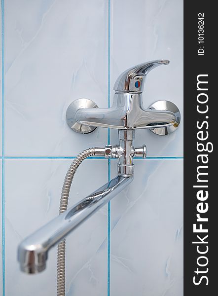 Metal, blue shiny bathroom tap