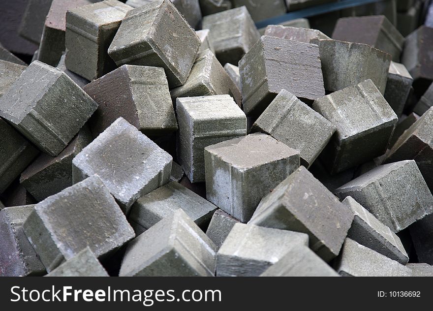 Cube grey sidewalk stone for paving of roads and sidewalks