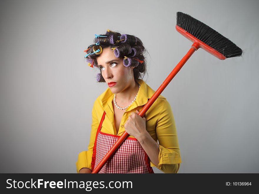 A sad housewife with broom