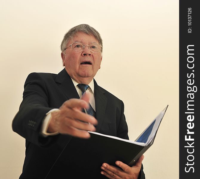 Businessman in suite and tie meeting client with file/folder in left hand, right hand extended for handshake, surprised look on face, all isolated on white background, space for print. Businessman in suite and tie meeting client with file/folder in left hand, right hand extended for handshake, surprised look on face, all isolated on white background, space for print.