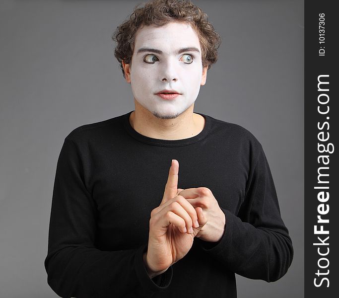 Portrait of the mime isolated on grey background