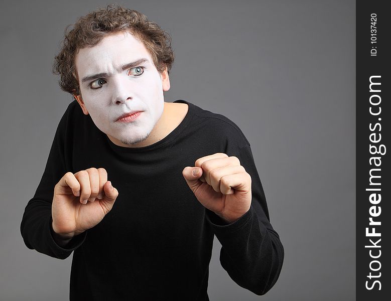 Portrait of the mime isolated on grey background