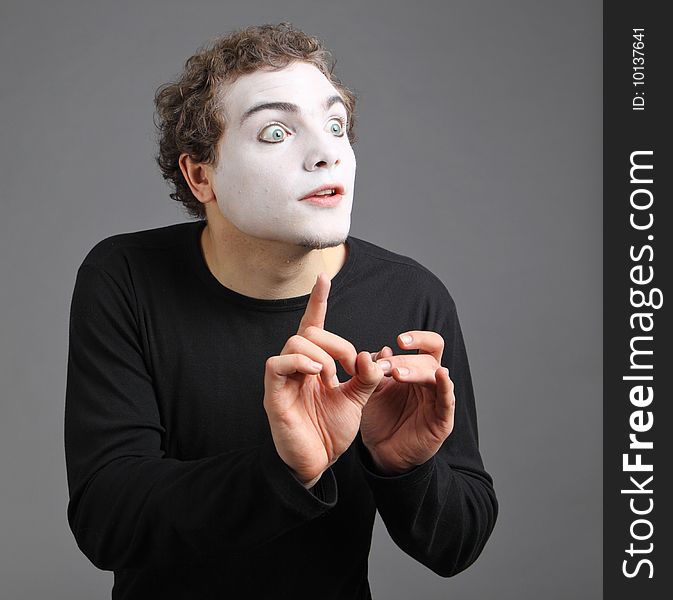 Portrait of the mime isolated on grey background