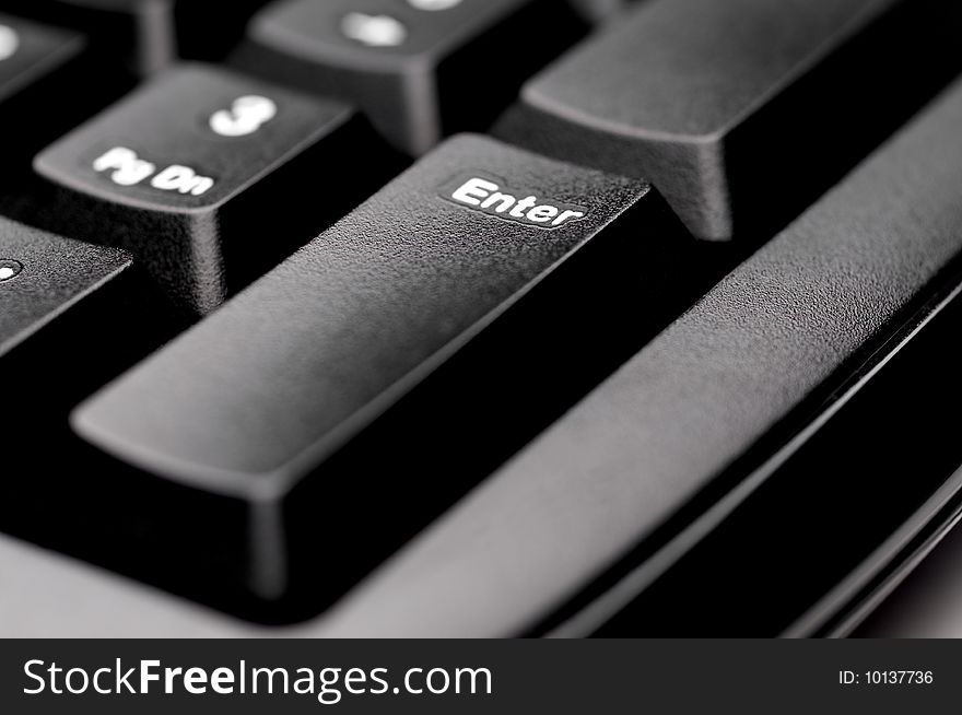 Macro of an Enter key on a black keyboard