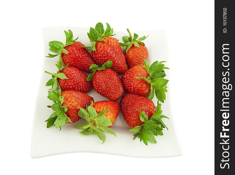 Ripe strawberry on a white square plate