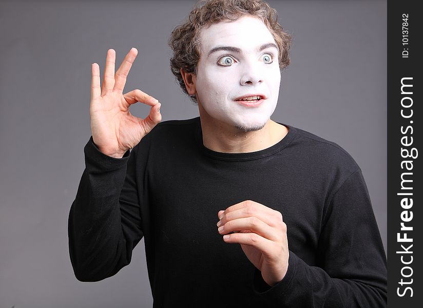 Portrait of the mime isolated on grey background