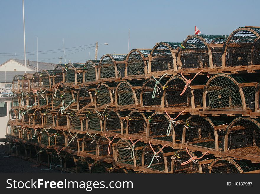 Lobster traps sit on the wharf in Prince Edward Island