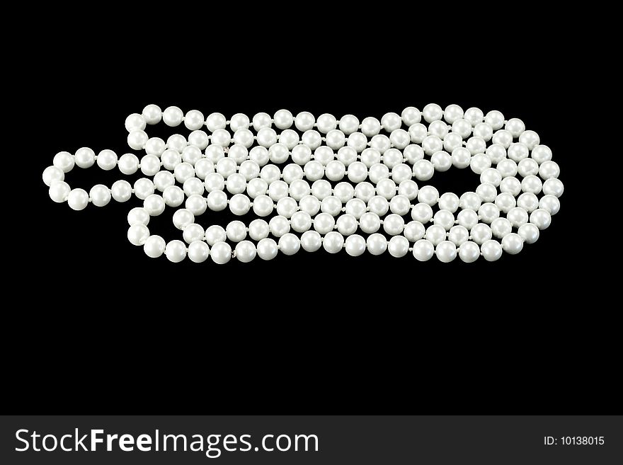 Pearl necklace isolated on black background