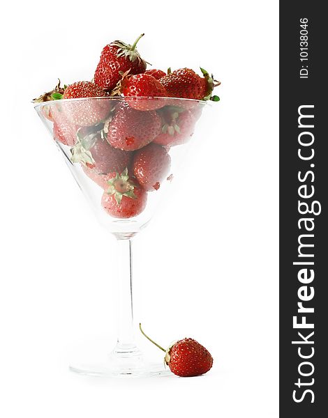 Strawberry in the glass on a white background. Strawberry in the glass on a white background