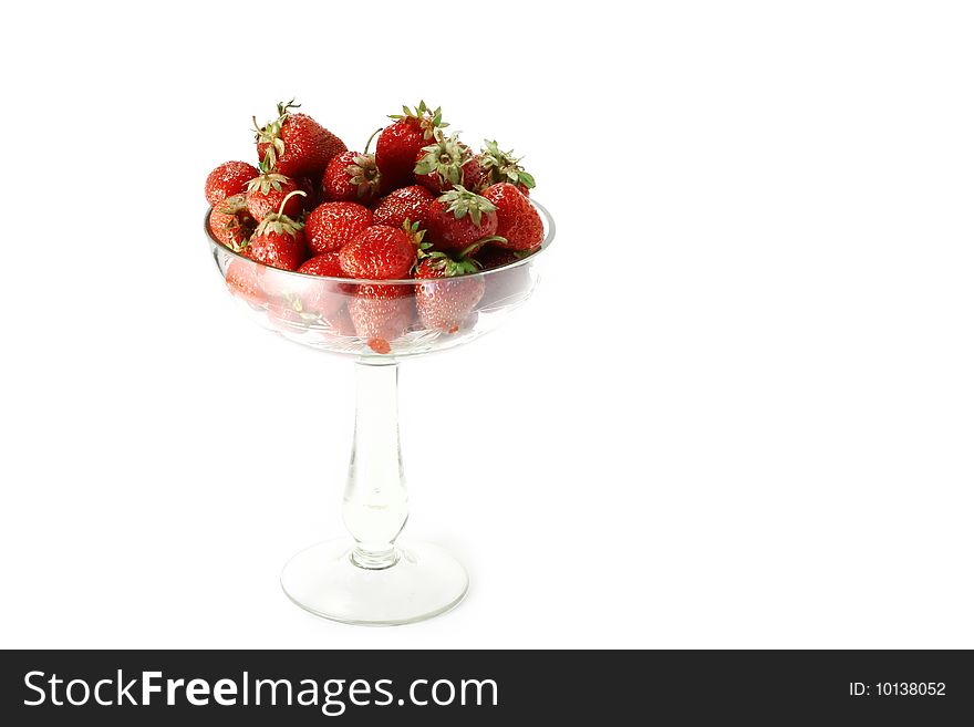 Strawberry in the glass on a white background. Strawberry in the glass on a white background