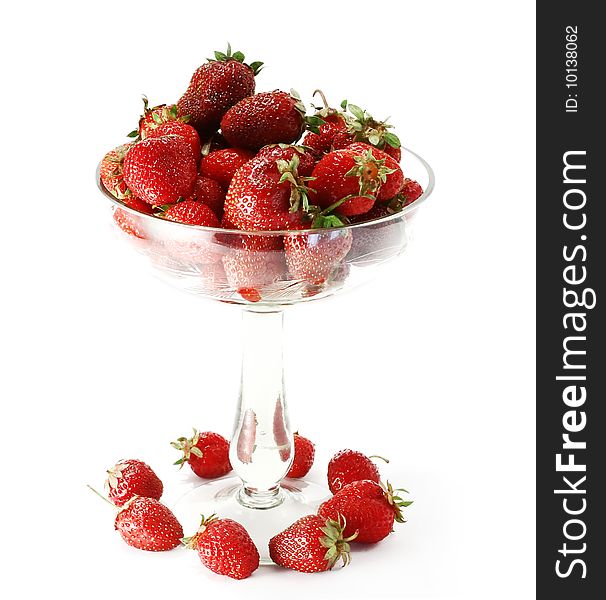 Strawberry in the glass on a white background. Strawberry in the glass on a white background