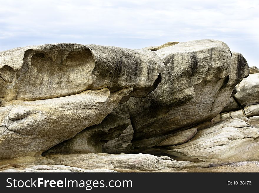 Huge rock on beach with contrast. Huge rock on beach with contrast