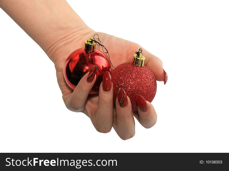 Manicure with red balls. Isolated