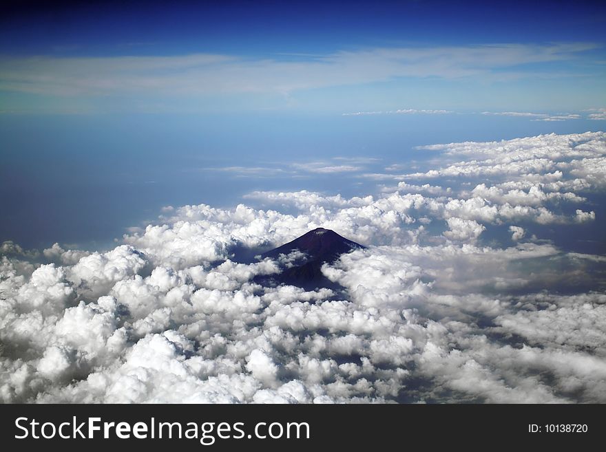 View to the volcano from the airplane. View to the volcano from the airplane