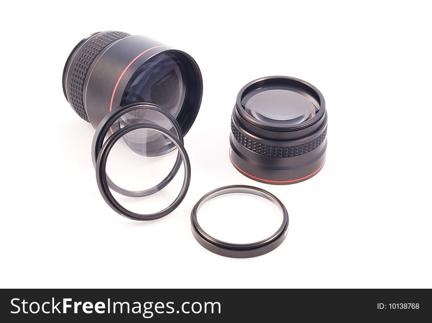 A number of photographic add-on lenses against a white background