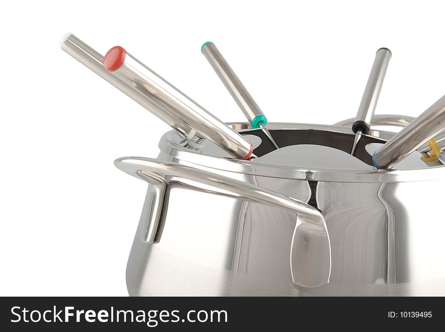 Close-up of a stainless steel fondue maker