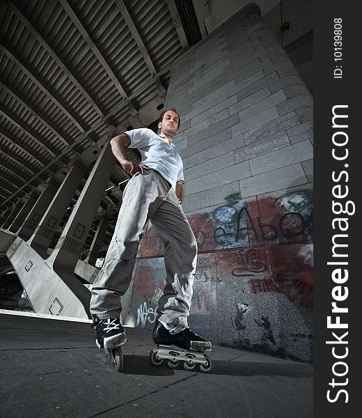 Wide angle photo of a rollerskater in urban scenery