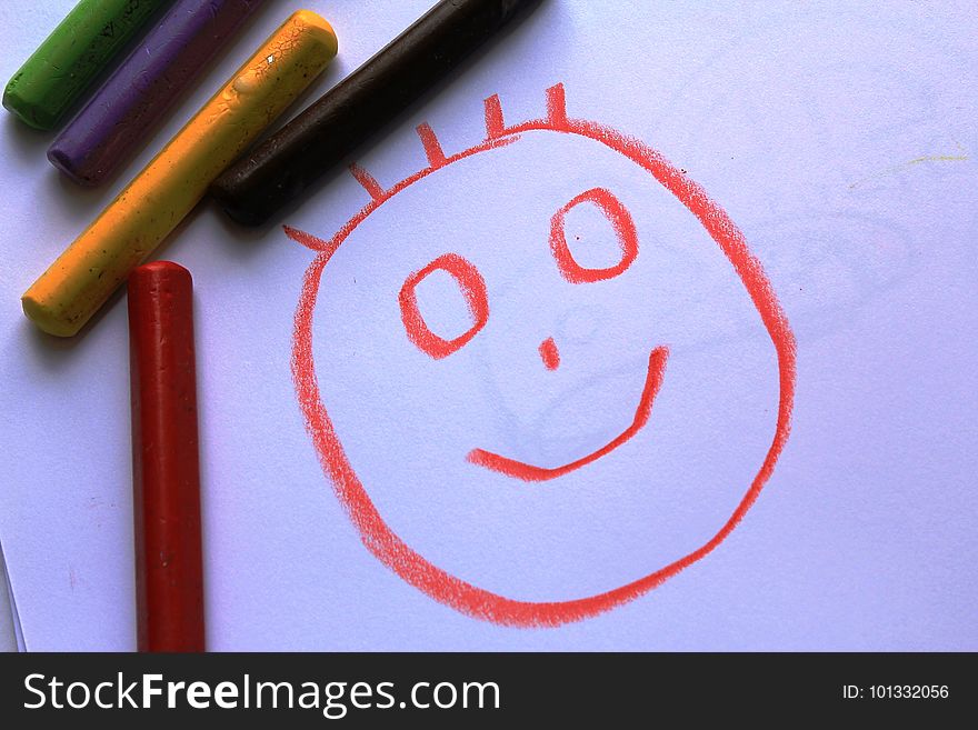 A Smiling Head On The Kid`s Drawing