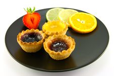 Jam Tarts On A Black Plate Stock Photo Jam Tarts On A Black Plate Stock Photo