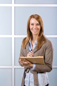 Business Woman Writing Notes At Desk Stock Images