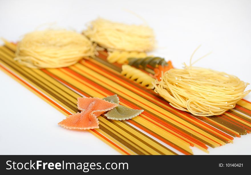 Raw spaghetti, farfalle and capellini