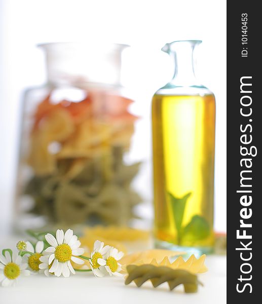 Pasta with oil bottle and camomile