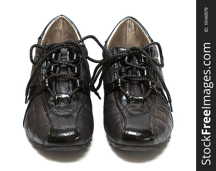 Black running womanish shoe isolated on white background