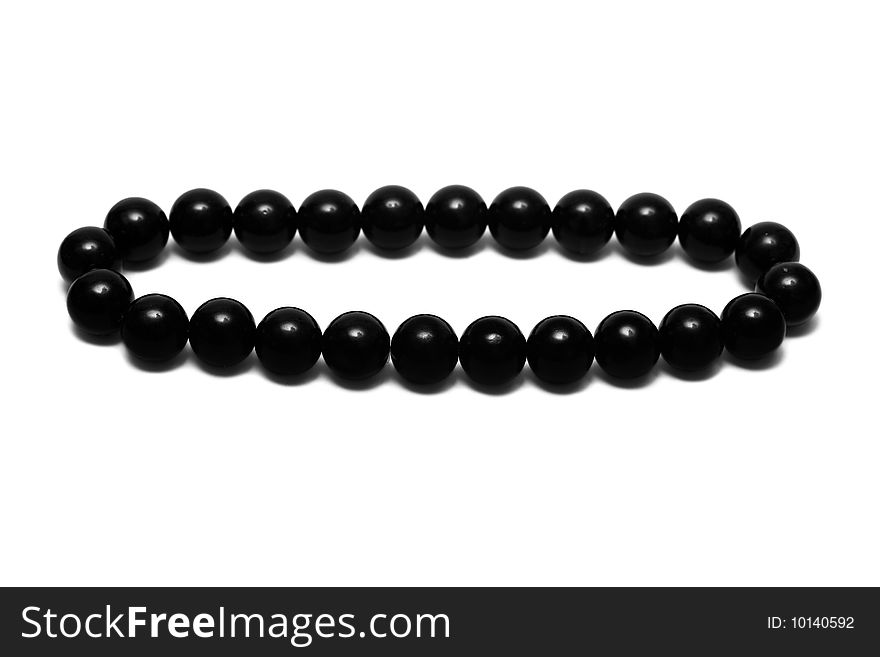 Black beads isolated on white background